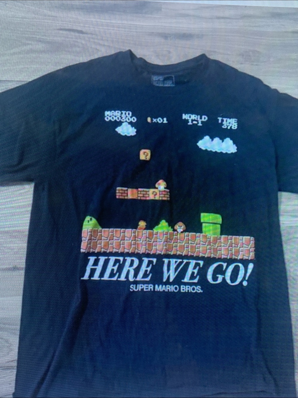 Nintendo Super Mario Bros. Black Tee with Colorful Level Art